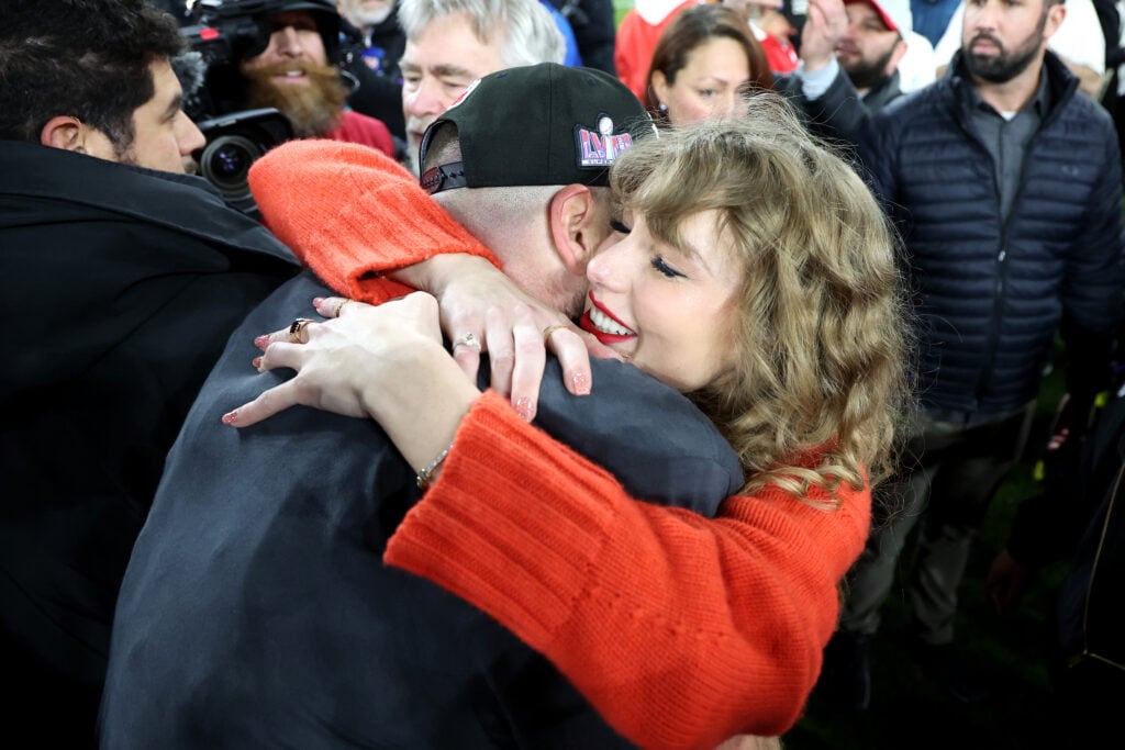 Taylor Swift and Travis Kelce embrace in January of 2024.